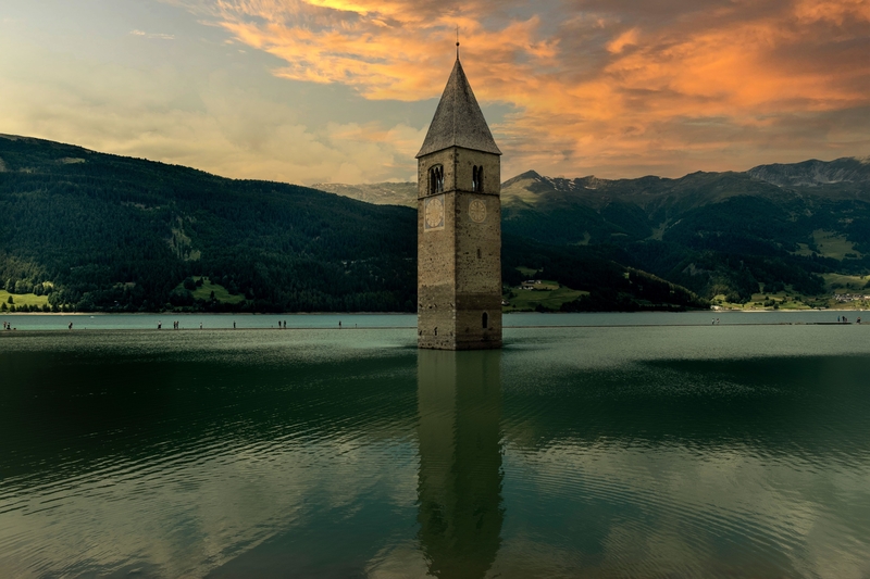 A Partially Submerged Bell Tower in Graun, Italy | Alamy Stock Photo