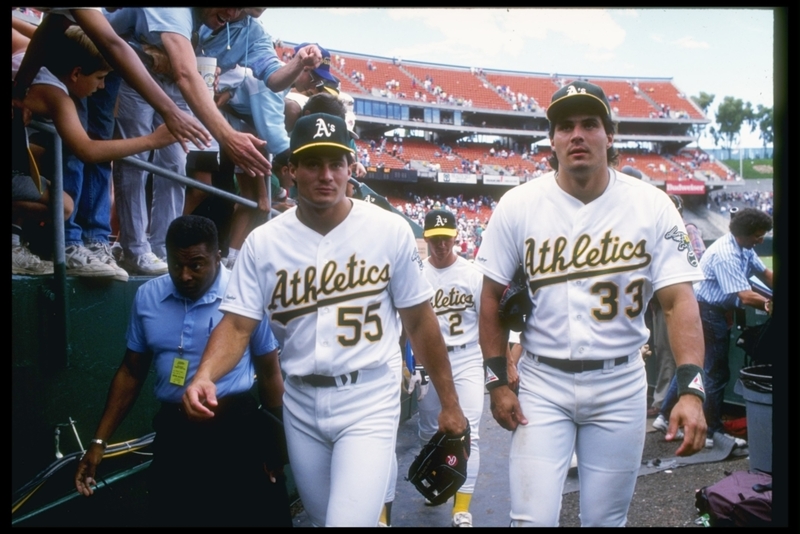 José Canseco y Ozzie Canseco | Getty Images Photo By Otto Greule/Allsport