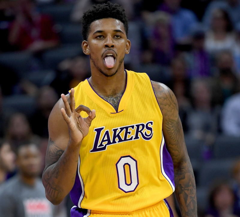 Nick Young Stole Travolta’s Swag | Getty Images Photo by Thearon W. Henderson