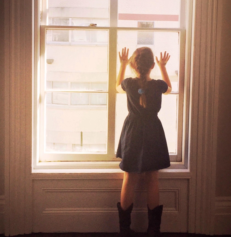 A Mysterious Window Girl | Alamy Stock Photo by Kimberlee Piper/Stockimo