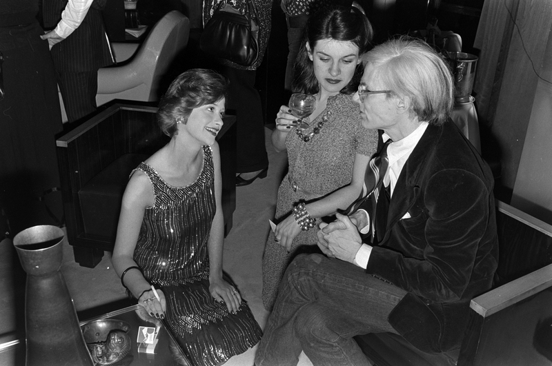 Andy Warhol Parties with Paloma Picasso | Getty Images Photo by Michel Maurou/WWD/Penske Media